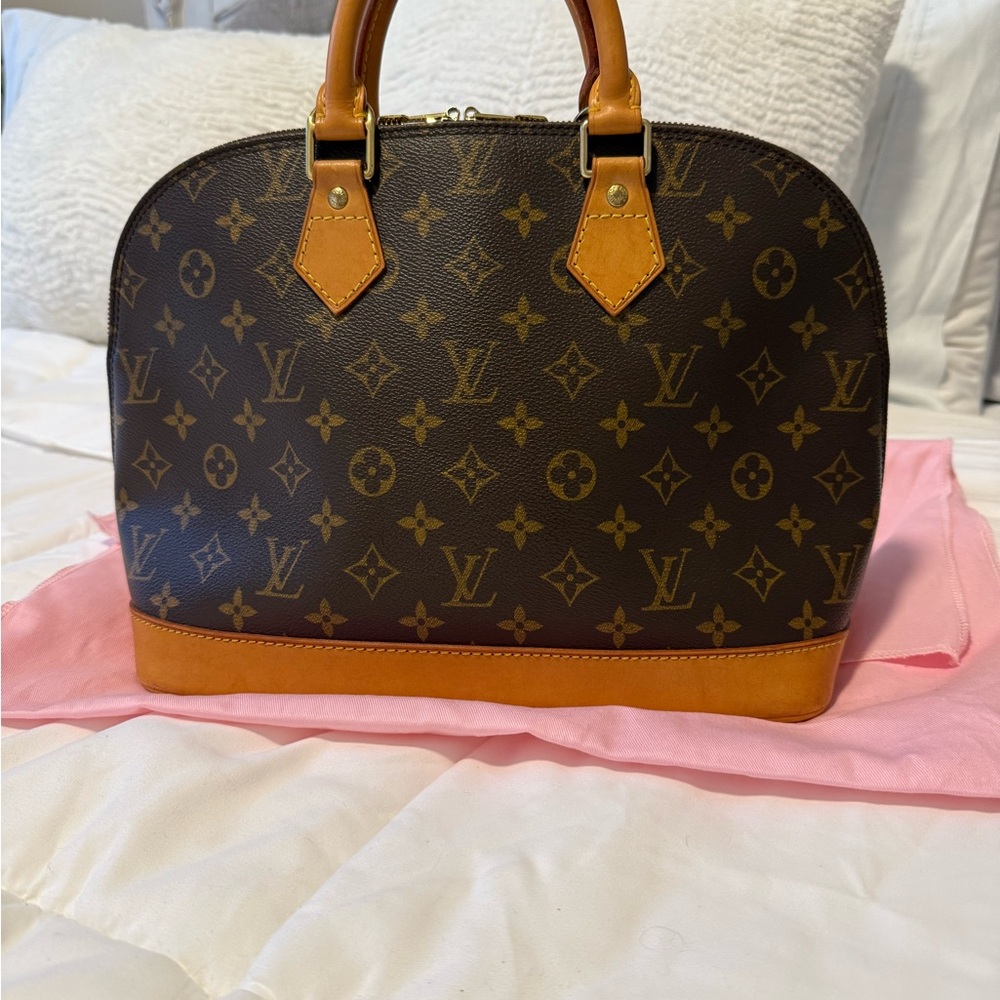 Louis Vuitton Alma Monogram Handbag